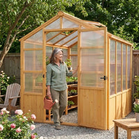 6X10 FT Wooden Greenhouse for Outdoor, Walk-In Greenhouse Kit with Ventilated Window & Lockable Door & Polycarbonate Panels, Large Wood Frame Green House for Garden, Backyard, Patio, Lawn, Plant — Lifestyle